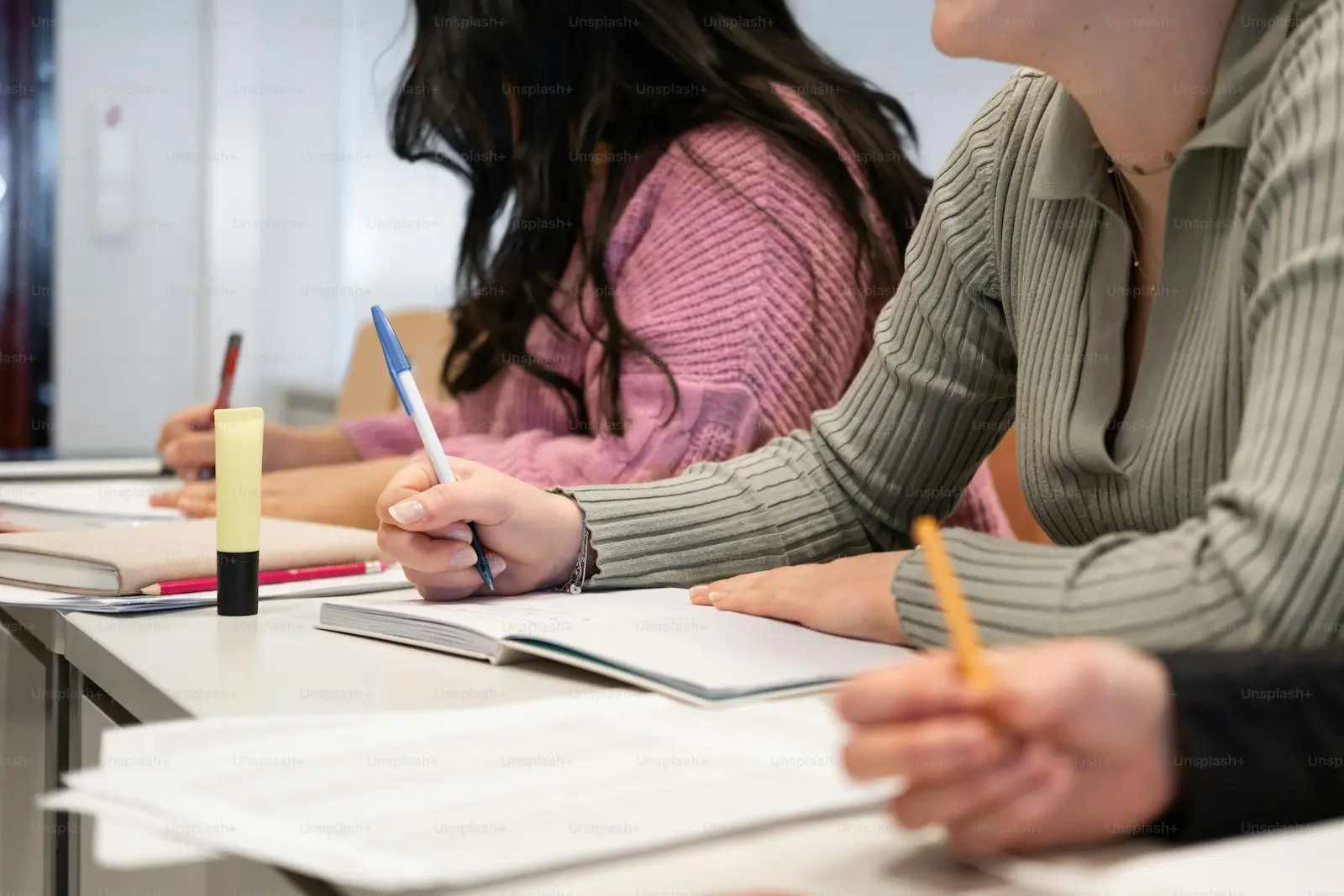 Adult learners studying English in a small-group class